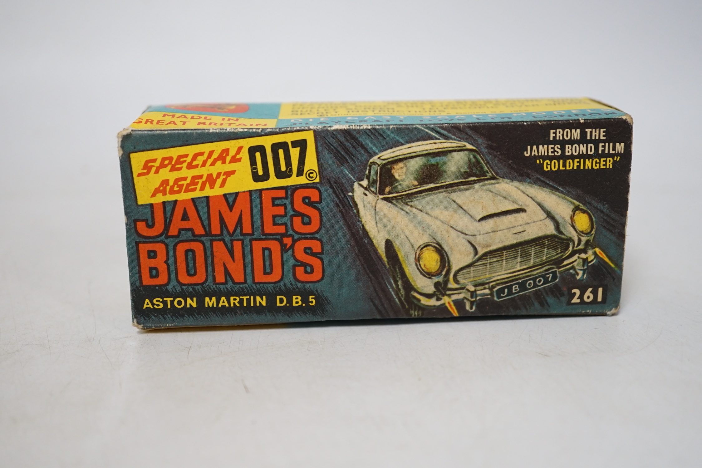 Corgi Toys James Bond's Aston Martin (261) in gold, boxed with driver, passenger, inner display tray, correct leaflet advertising other Corgi models and a ‘Secret Instructions’ envelope containing instructions and unused